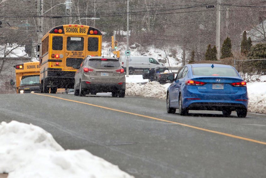 
Traffic stops for a school bus along Old Sambro Road in Spryfield on Wednesday. PC MLA Pat Dunn says drivers who pass a school bus while its safety lights are engaged should have their licences suspended for six months and face a fine of up to $5,000.
