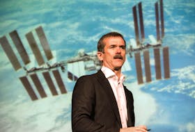 
Former astronaut Chris Hadfield, backdropped by a photo of the International Space Station, speaks at Dalhousie University in 2014. About 250 of the photos he took of the Earth during his stint on the space station has been compiled into an interactive collection. - File
