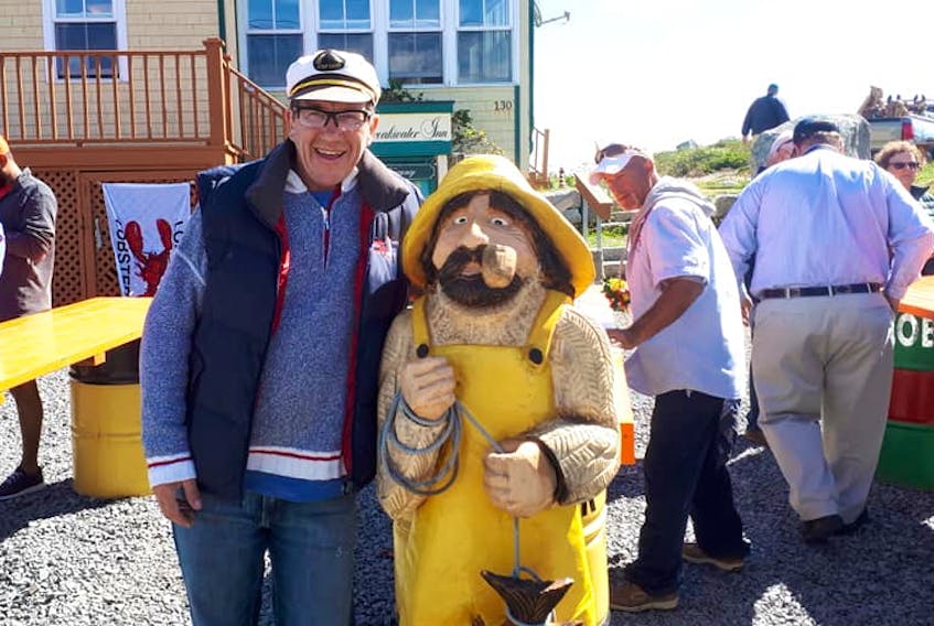 
Peter Richardson of Peggy’s Cove Boat Tours poses next to Shorty. - Facebook
