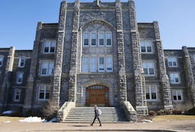 
A student walks past the front of the McNally Building on the campus of Saint Mary’s University in Halifax. - Tim Krochak
