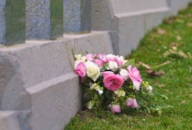 
Flowers rest against one of the graves of Titanic victims at the Fairview cemetery in Halifax. - FILE
