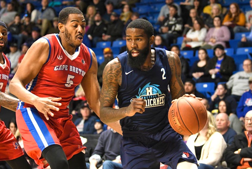 
Terry Thomas of the Halifax Hurricanes, right, works his way around Theron Laudermill of the Cape Breton Highlanders during Game 4 of the NBL Canada playoff series Wednesday at Centre 200. 
