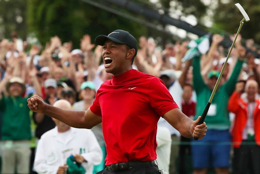 
Tiger Woods celebrates on the 18th hole after winning the the 2019 Masters title at Augusta, Ga., on Sunday. - Reuters

