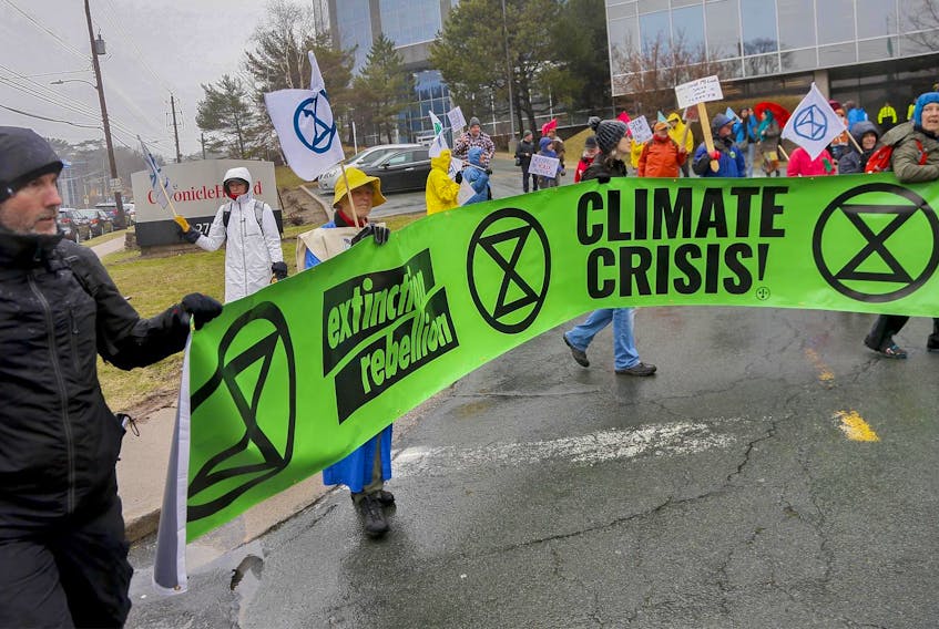 
Demonstrators take part in Monday’s Extinction Rebellion march in front of the offices of The Chronicle Herald in Halifax on Monday. The march was held to bring an awareness about what the group says is a complete lack of inaction on the imminent climate breakdown. - Tim Krochak
