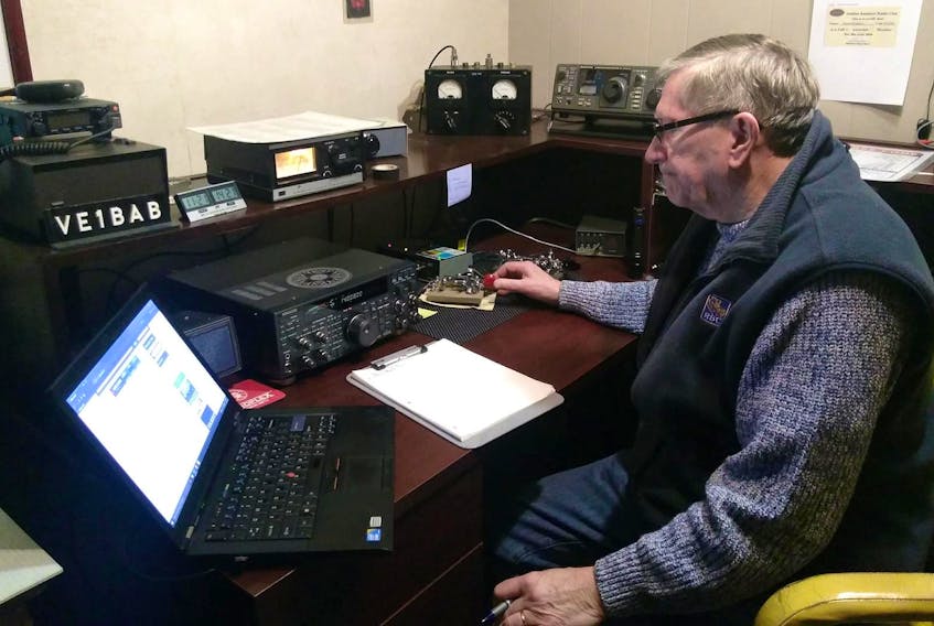 Wayne Blenkhorn of Port Williams, N.S., is a retired radio operator with the Canadian Navy. He knows Morse code like a second language and connects with other operators through this system. Here, he is connecting with someone in Germany.
