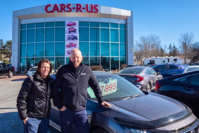 Gary and Evelyn Shea’s Cars-R-Us sells about 100 vehicles a month that last year generated about $32 million in gross sales.