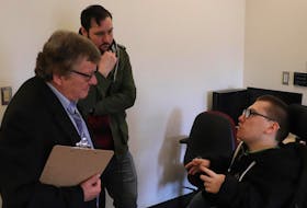 Cast members Frank Kirby and Josh Lawrence (left) go over a scene with director Spencer MacKay for the Halifax-shot short film that was made over a single weekend for the 2019 Easterseals Disability Film Challenge.
