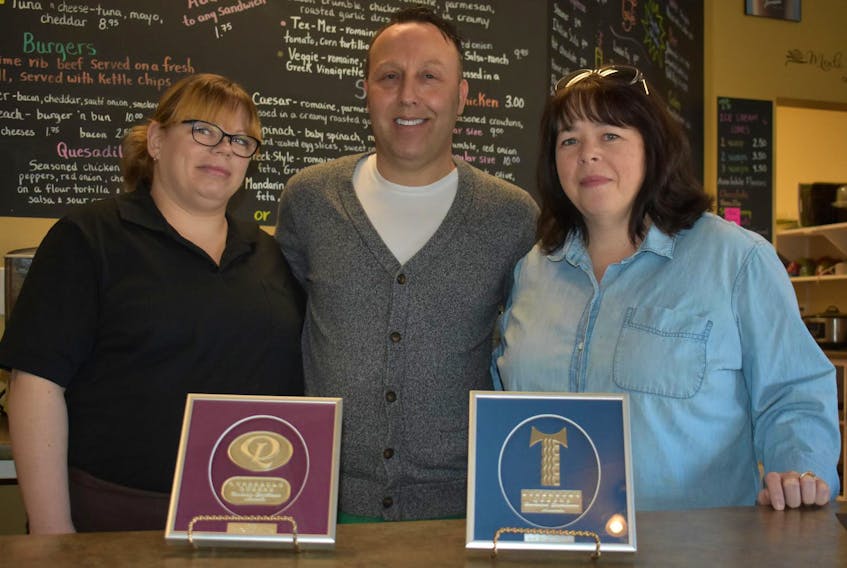 
Employees Amanda Whynot (left), Jeffrey Whynot (centre) and Memories Café owner Linda Smith (right) pose with LQBEA outstanding service award.
