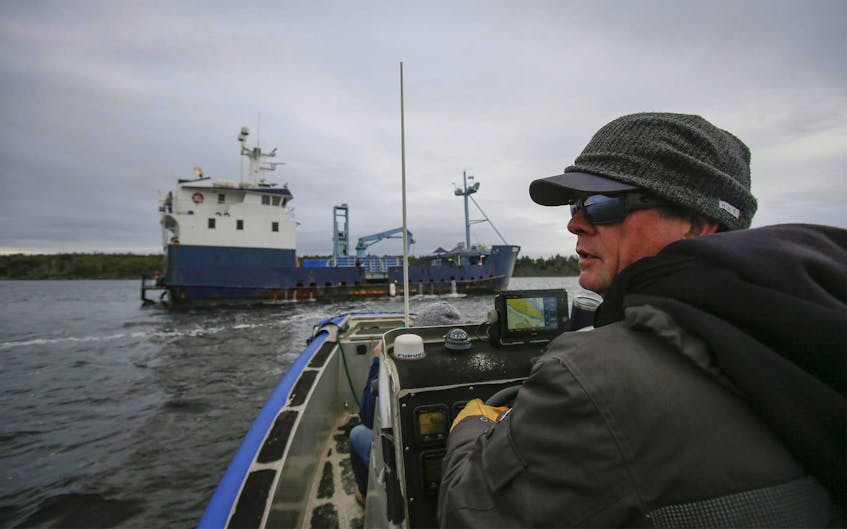 
Chris Fischer, expedition leader of the M/V Ocearch pulls up to the vessel off Moshers Island, near Riverport last October.