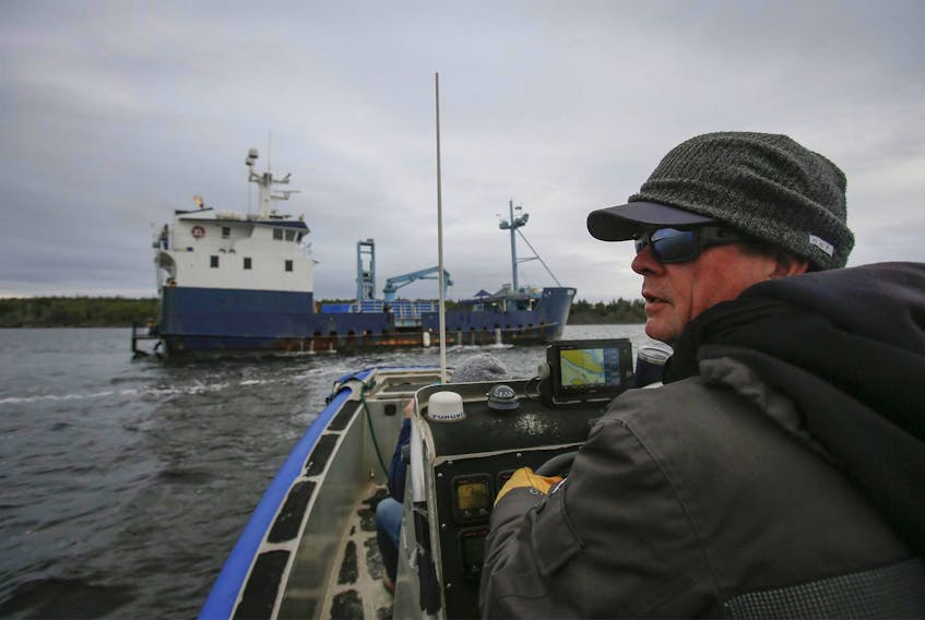 
Chris Fischer, expedition leader of the M/V Ocearch pulls up to the vessel off Moshers Island, near Riverport last October.