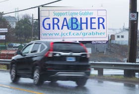 
A vehicle passes in front of a digital billboard on Barrington Street asking people to support Lorne Grabher in his court battle to use a vanity licence plate with his last name. - Ryan Taplin
