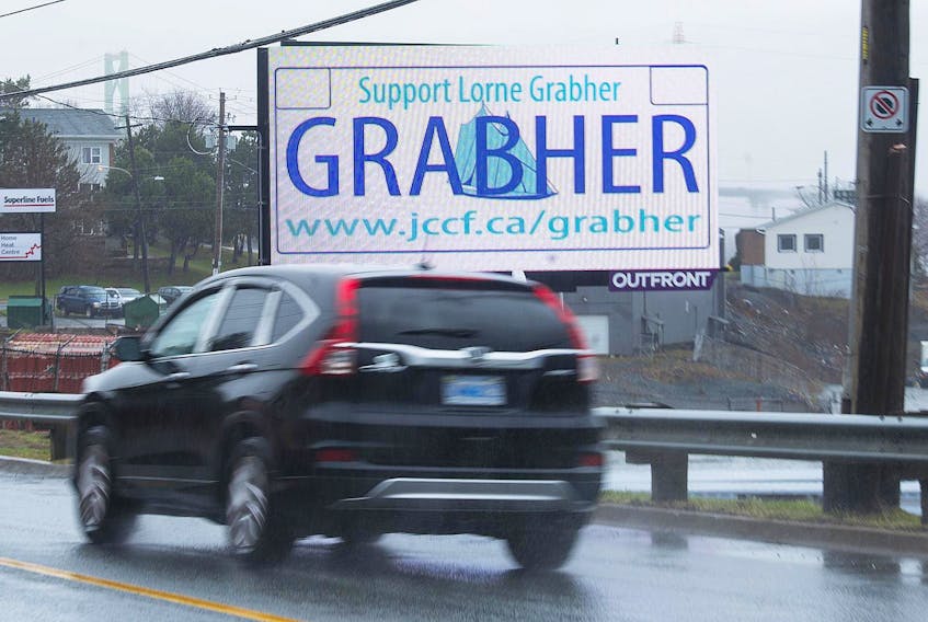 
A vehicle passes in front of a digital billboard on Barrington Street asking people to support Lorne Grabher in his court battle to use a vanity licence plate with his last name. - Ryan Taplin
