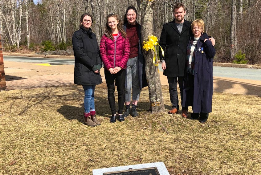 Each year students, staff, and family members gather to honour Pte. Rick Green and Pte. Nathan Smith by attaching a yellow ribbon to a tree adjacent to a monument built in their honour.