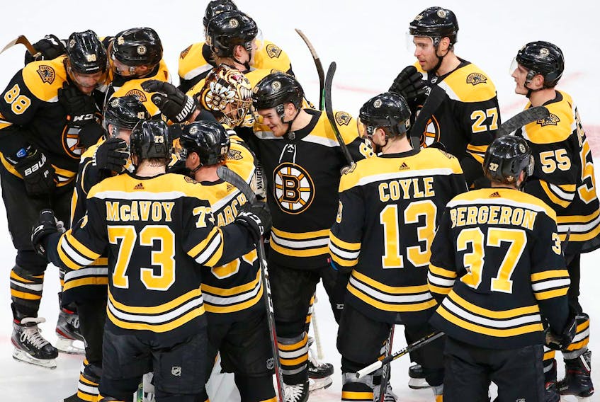
 Boston Bruins goaltender Tuukka Rask celebrates with teammates after defeating the Toronto Maple Leafs in game seven of the first round of the 2019 Stanley Cup Playoffs at TD Garden on April 23, 2019. - Greg M. Cooper / USA TODAY Sports
