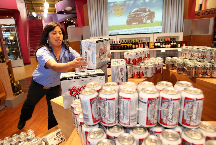 
Jocelyn Croox stocks some beer for a display at the Bayer's Lake NLSC store. in 2017. - Eric Wynne
