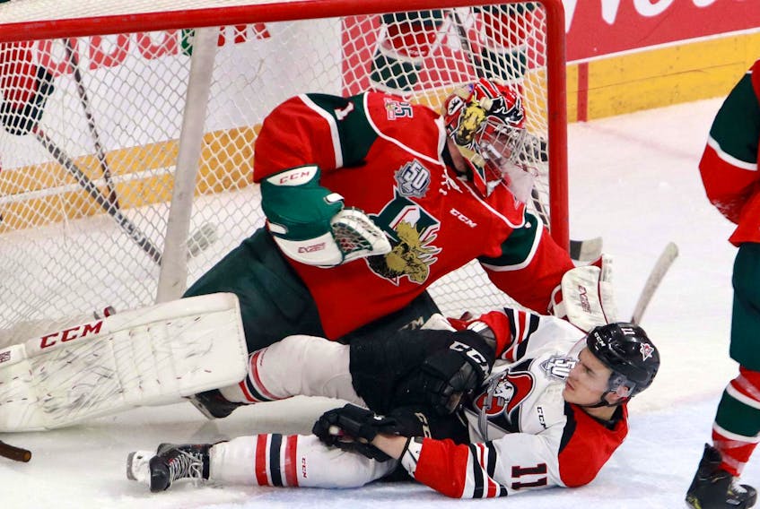 
Drummondville Voltigeurs’ forward Brandon Skubel slides into Halifax Mooseheads’ goalie Alex Gravel during Game 4 Wednesday night at Scotiabank Centre. The Mooseheads won 5-2 to take a 3-1 Round 3 series lead. - Eric Wynne
