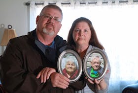
Brother and sister, Shawn Newhook and Barb DeJong, hold photographs of their parents, Josephine Frances and Murdoch James. - Eric Wynne
