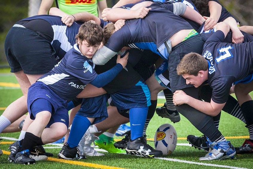 
High school rugby players battle for the ball in Halifax in May 2017. - File
