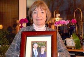 
Norma Silverstein holds a photograph of her parents at her home in Albert Bridge in March. Silverstein’s father, John Ferguson, died of septic shock caused by bedsores. - Cape Breton Post
