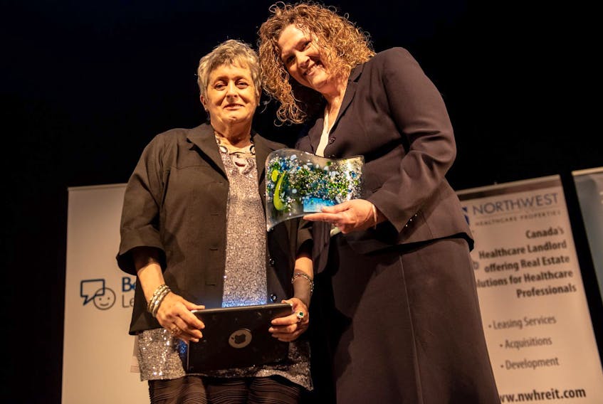 
Judi Quann (left) accepts her Let’s Keep Talking Award for Outstanding Senior. Standing next to her is Janet Simm of Northwood Intouch. - Stoo Metz

