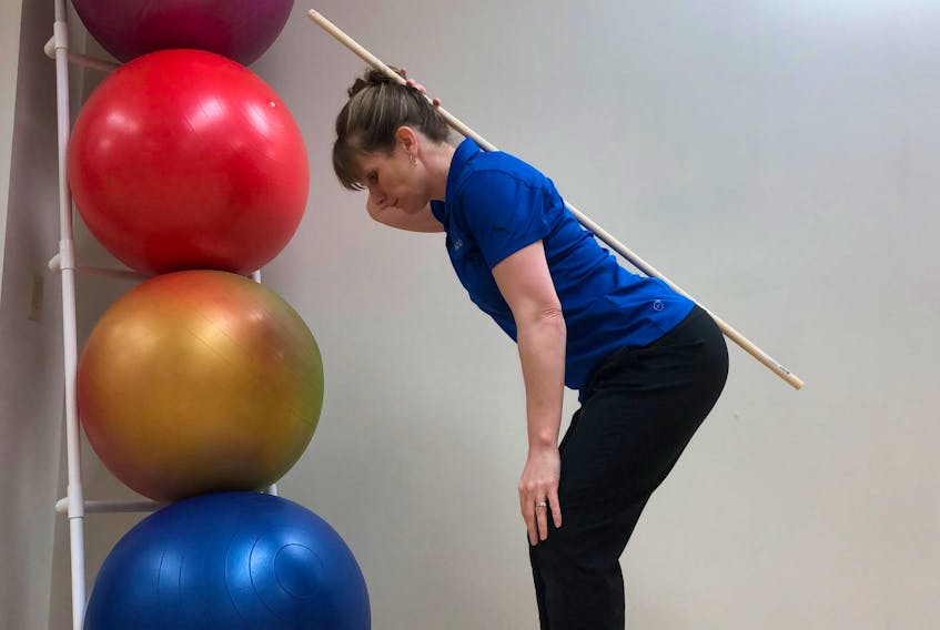 
Physiotherapist Laura Lundquist demonstrates the hip hinge. 
