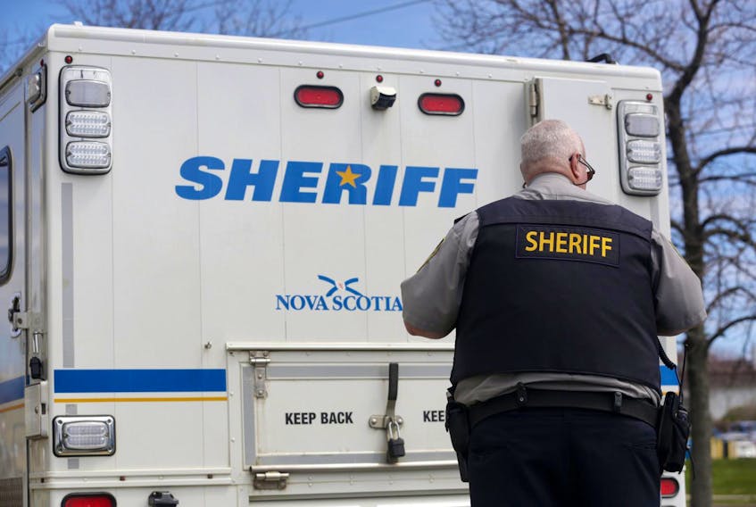
Sheriff's officer outside a prisoner transport van at courthouse in Dartmouth, Monday, May 2, 2016. - File
