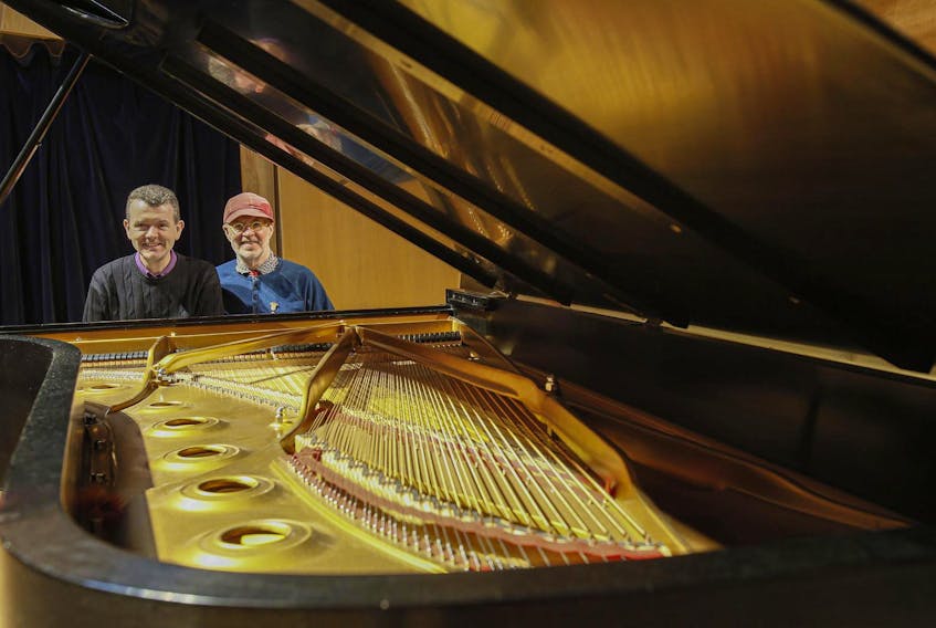 
Simon Docking, left, and Chris Wilcox, the outgoing managing and artistic director of the Scotia Festival of Music, sit at a piano at The Music Room in Halifax on May 5.

