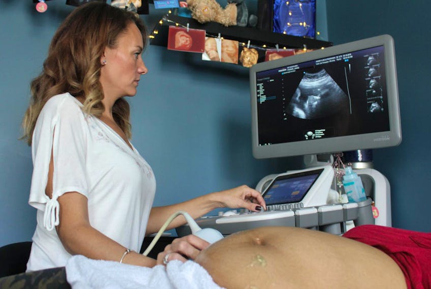 
Tanya Brothers-Balsor of Mommy and Me Ultrasounds in Kentville performs an ultrasound on a client. - Ian Fairclough
