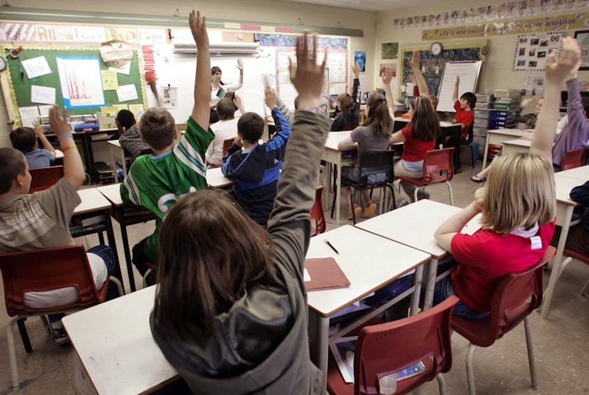 
Students put up their hands in a Grade 6 class at Fairview Heights Elementary in Halifax. The March 2018 report of the commission on inclusive education called for an independent Nova Scotia Institute for Inclusive Education, but that call has gone unheeded. - Eric Wynne
