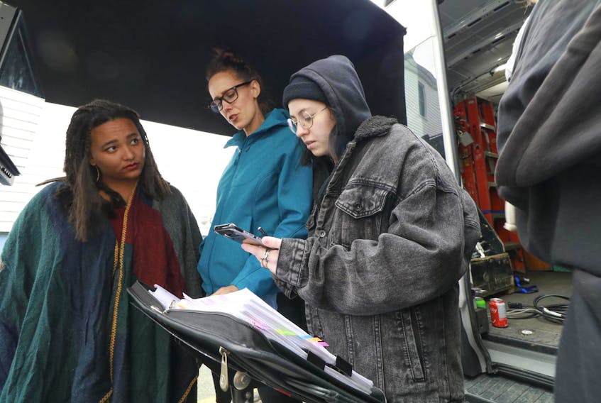 
Director Koumbie, left, and producer and show creator Amy Trefry go over the shoot list as they film on Quinn Street in Halifax. The shoot was for the web series, I Hear You, a recipient of Telefilm’s Talent to Watch fund. Each episode of the medical drama introduces a different woman, from puberty to menopause, who each struggle with sexual health issues.

