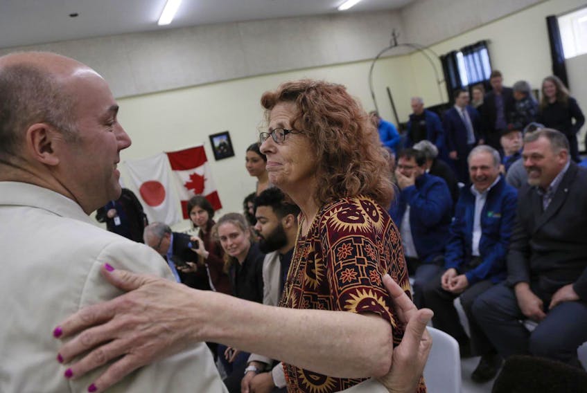 
Halifax MP Andy Fillmore, left, and Harrietsfield resident Marlene Brown gesture towards one another following an announcement on Thursday that the federal and provincial governments will be dealing with water contamination in Harrietsfield. - Tim Krochak
