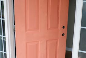 
Heather painted her paneled front door in a specific order using a single paint brush — no mini roller required.
