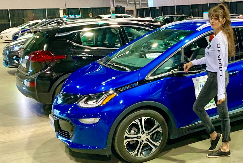 
Lisa Calvi stands with the 2019 Chevrolet Bolt electric vehicle at Quebec City’s Salon du véhicule électrique.
