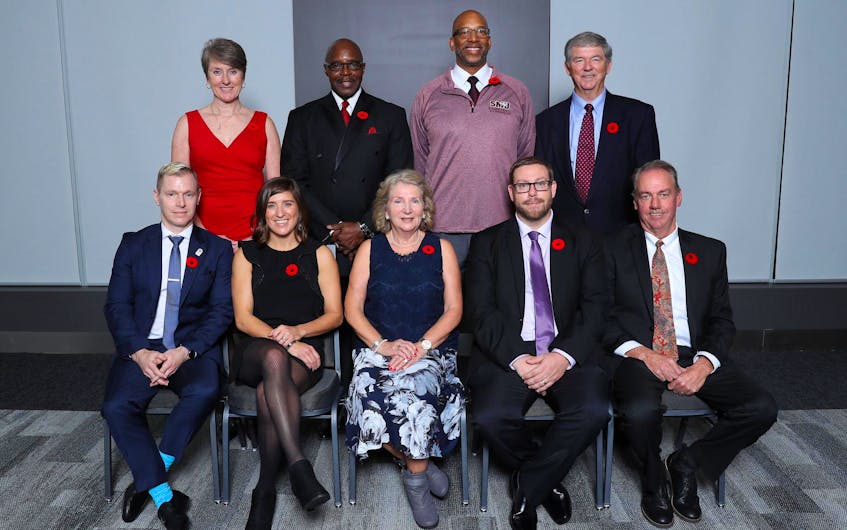 Brian Heaney is seen in the back-right of this photo during a Nova Scotia Sports Hall of Fame induction ceremony in 2018. The former standout Acadia basketball player thinks that if the Raptors can steal Games 1 and 2 at home in Toronto, they have a good shot at winning the seven-game series. - Nova Scotia Sport Hall of Fame