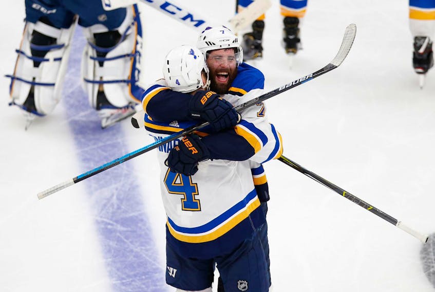
St. Louis Blues defenceman Carl Gunnarsson (4) celebrates with left wing Pat Maroon (7) after scoring the game-winning goal against the Boston Bruins during an overtime period in Game 2 of the Stanley Cup Final at TD Garden on Wednesday, May 29, 2019. - Greg M. Cooper / USA TODAY Sports
