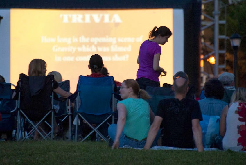 
People gather on the waterfront to watch the movie Gravity during the Atlantic Film Festival Outdoor Film Experience in Halifax in this file photo from 2014. It will be the Summer of Sing Alongs. - Adrien Veczan / File
