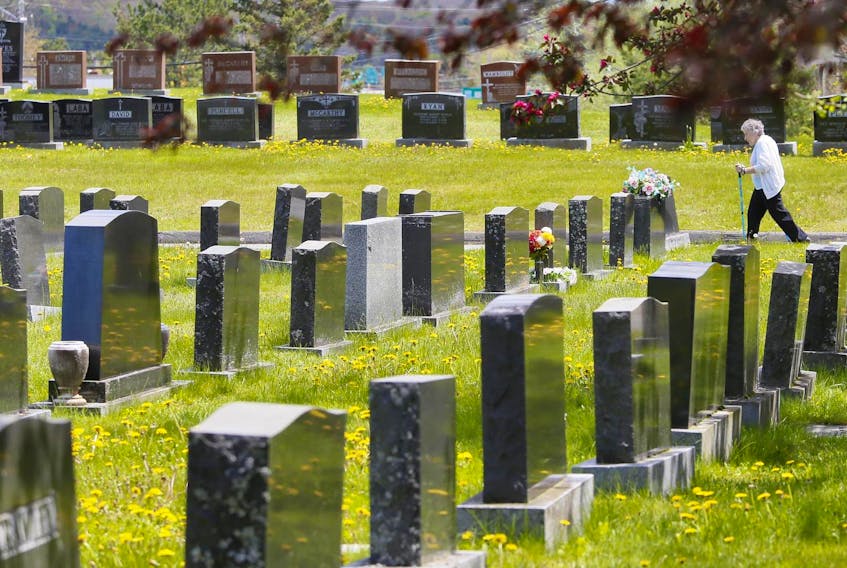 
A woman goes for her daily walk in a Lower Sackville cemetery Tuesday, June 4, 2019. - Tim Krochak
