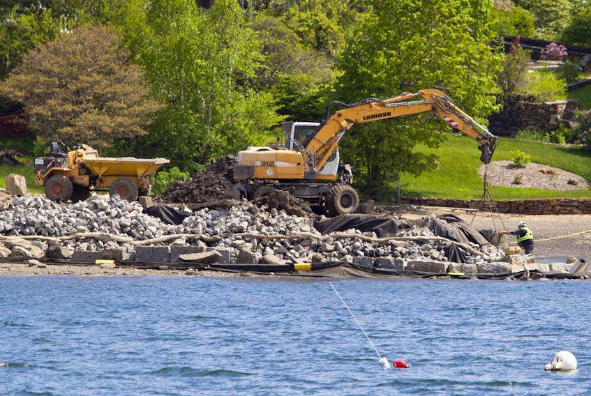 
Construction workers replace the seawall on Horseshoe Island in the Northwest Arm in Halifax on Tuesday.