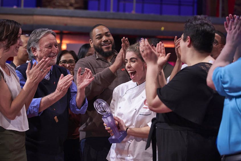
Jennifer Crawford of Kingston, N.S. accepts the trophy and the applause after winning this season of Masterchef Canada. - Geoff George

