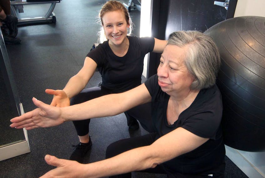 
Leanne Wiese (left), who owns and operates Wiese Moves, trains Nancy Briand in the gym at the Maple on Hollis Street in Halifax.
