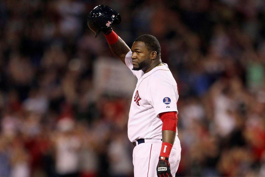 
Boston Red Sox designated hitter David Ortiz salutes the crowd after getting his 2,000th career on Sept. 4, 2013. - Dominick Reuter / Reuters
