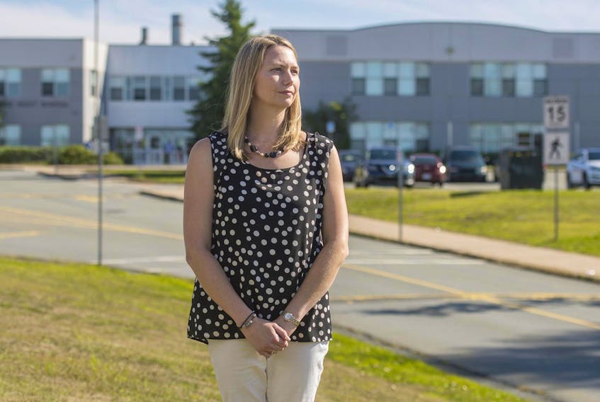 Laura Ankcorn stands outside Park West school in Halifax last September. As a parent of three students at the school, she is concerned about overcrowding there. FILE 
 
