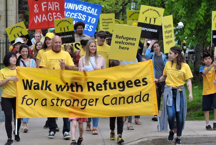 
Yellow shirts and spirited chants livened up the sidewalks around the Public Gardens and down Spring Garden Road during the Walk with Refugees on Sunday afternoon. The march drummed up a crowd of hundreds to underline Canada’s importance as a welcoming place for those fleeing troubled circumstances in other countries.
