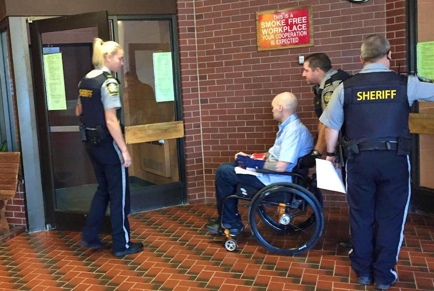 Leif Spilchen is wheeled into Kentville provincial court on Oct 4, 2017.