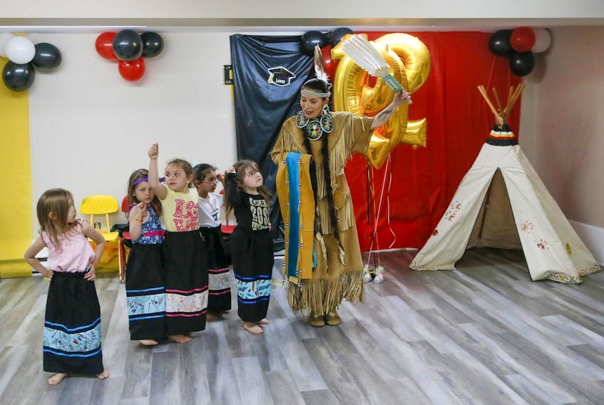 
Denise Mitchell leads youngsters in the womens traditional dance, during their Mi’kmaw dance rehearsal for an upcoming National Indigenous Day celebration, at the Mi’kmaw Native Friendship Centre Day Care, in Halifax on Friday June 14, 2019. 
