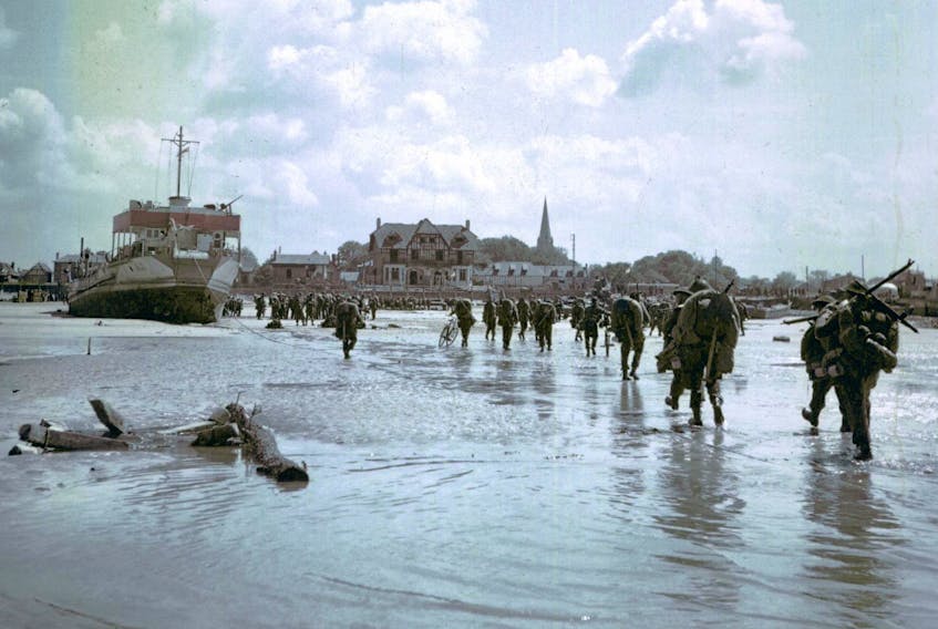 
Canadian soldiers make their way across Juno beach as part of Operation Overlord.


