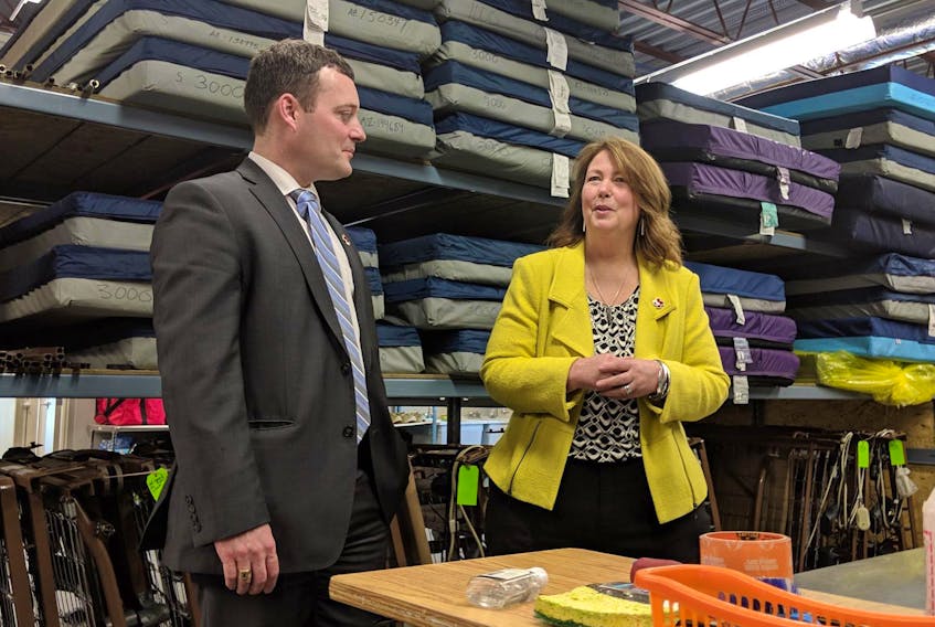 
Specialized mattresses for nursing home beds can be seen behind Health Minister Randy Delorey and Christina Baert-Wilson, senior director of Community and Health Services with the Canadian Red Cross, during a tour of the Red Cross’s equipment facility in Dartmouth in March. - John McPhee
