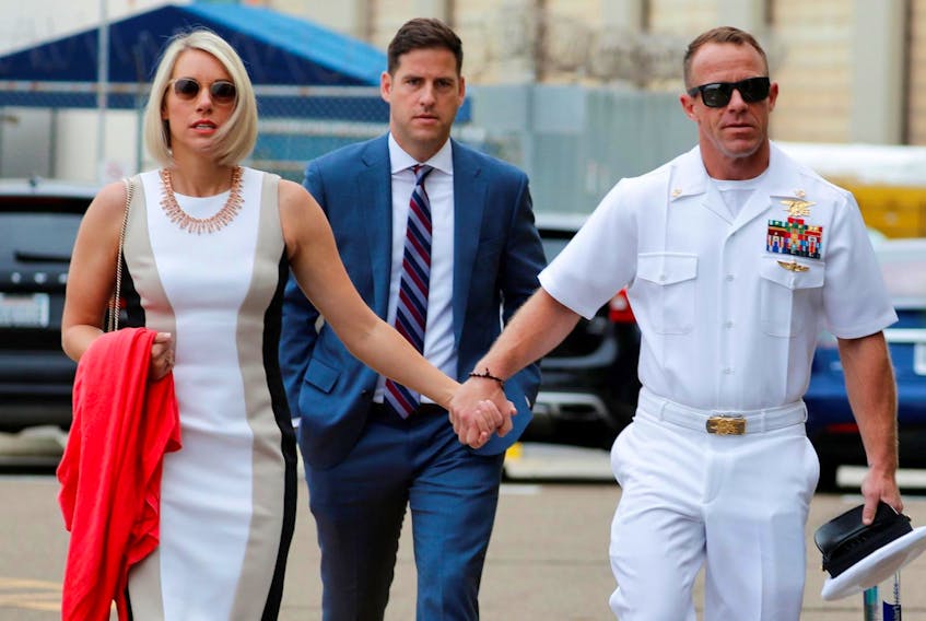 
U.S. Navy SEAL Special Operations Chief Edward Gallagher arrives at court with his wife Andrea and brother Sean, centre, for the start of his court martial at Naval Base San Diego in San Diego, Calif., June 18, 2019. Mike Blake / Reuters
