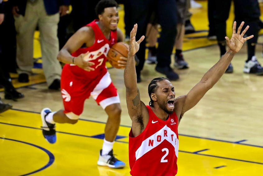 
Toronto Raptors forward Kawhi Leonard (2) and Toronto Raptors guard Kyle Lowry (7) celebrate winning the NBA championship over the Golden State Warriors in game six of the final at Oracle Arena in Oakland, Calif., on June 13, 2019. - Sergio Estrada / USA TODAY Sports
