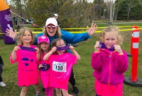 
Lee Anne Webber has fun with her Primary run club students at a youth race. Executive director Kerry Copeland says half of Kids Run Club participants have been girls from the very beginning. 
